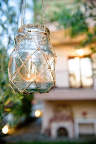 a glass light bulb hanging from a string at Dili Apartments in Ierissos