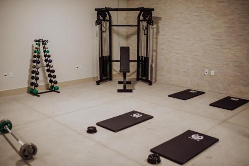 a gym with several mats on the floor in a room at MANANCIAL HOTEL E EVENTOS in Manhuaçu