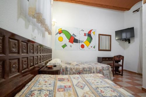 Postel nebo postele na pokoji v ubytování APAR. SIERRAGUADALQUIVIR