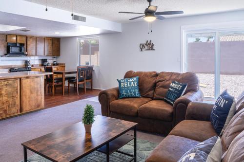 a living room with a couch and a table at Cheerful Pool Home-Lowkey, 10min to Lake, Comfort in Lake Havasu City