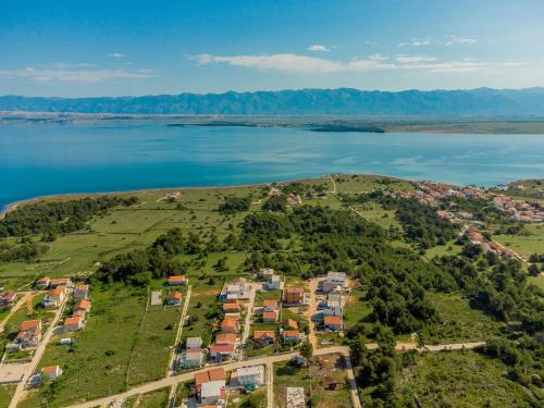 an aerial view of a village on a hill by the water at Appartements VIR in Vir