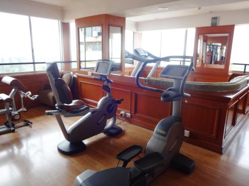 a gym with several exercise bikes and treadmills at Royal Orchid Central Bangalore, MG Road in Bengaluru