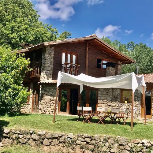 a house with a tent in front of it at Quinta dos Carvalhos The Wine House Farm in Center of Lamego - Capital of the Douro in Lamego