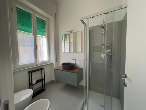 a bathroom with a shower and a sink at Bed and coffee Rooms Portoferraio in Portoferraio