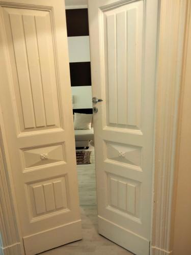 a white door in a room at Al Campanile in Piazza Armerina
