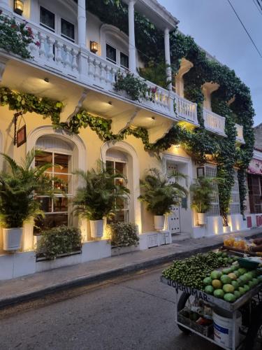 a building with plants on the side of it at Hotel Casa Lola Deluxe Gallery in Cartagena de Indias