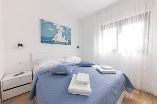 Posteľ alebo postele v izbe v ubytovaní Apartman Ivan & Marko