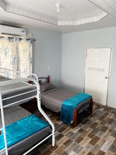 a room with two bunk beds in a room at Carnbee Cozy Cottage in Bethel