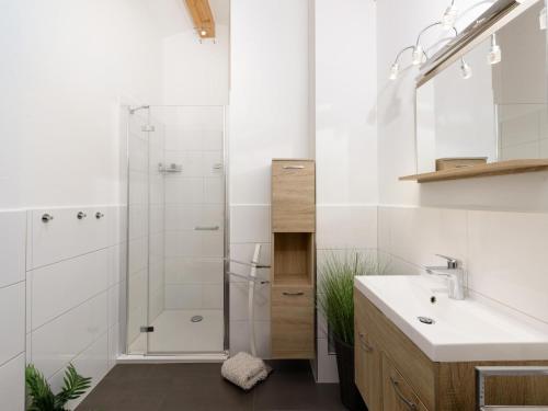 a bathroom with a shower and a sink at Chalet Windbach in Saalbach Hinterglemm