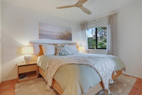 En eller flere senge i et værelse på Rosie's Seaview-Lake to ocean view