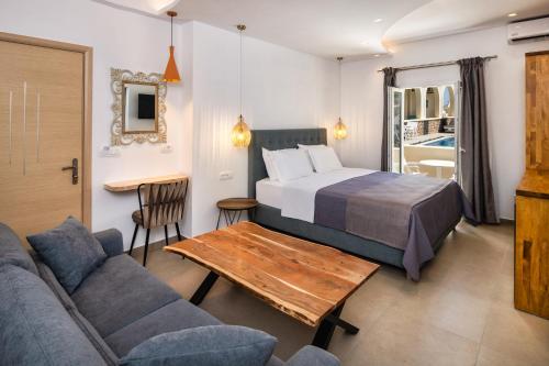 Postel nebo postele na pokoji v ubytování Alizea Villas & Suites