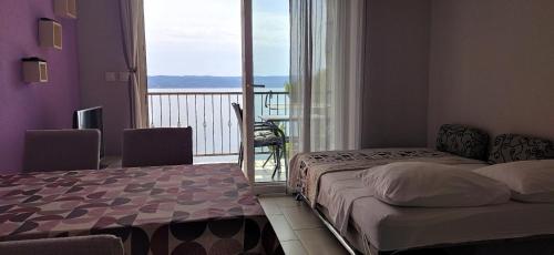 Posteľ alebo postele v izbe v ubytovaní Victoria Apartments