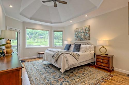 a bedroom with a bed and a ceiling fan at Chic Sky Valley Resort Home on Golf Course! in Sky Valley
