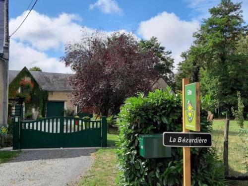 a sign in front of a house with a gate at Maison de campagne rénovée avec jardin clos, proche Tours et grands sites du Val de Loire - FR-1-381-97 in Beaumont-la-Ronce