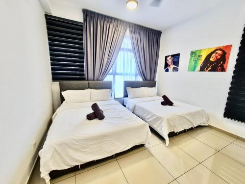 Postel nebo postele na pokoji v ubytování Atlantis Residences Malacca City by Nestcove