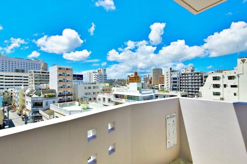 a balcony with a view of a city at ゆかるひ前島501 in Tomari