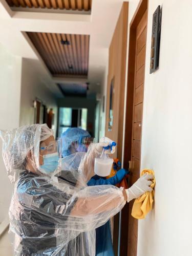 a group of people in protective gear in a hallway at Montana Hotel Songkhla in Songkhla