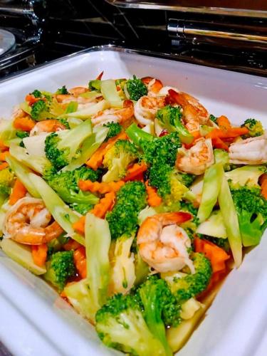 a dish of shrimp and vegetables on a plate at Montana Hotel Songkhla in Songkhla