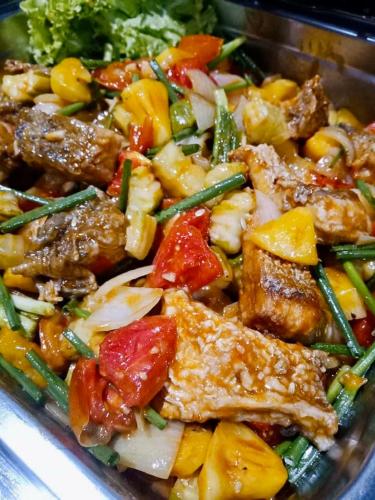 a dish of food with meat and vegetables at Montana Hotel Songkhla in Songkhla