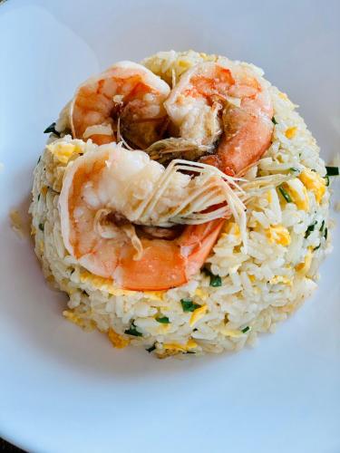 a plate of rice with shrimp on top of it at Montana Hotel Songkhla in Songkhla