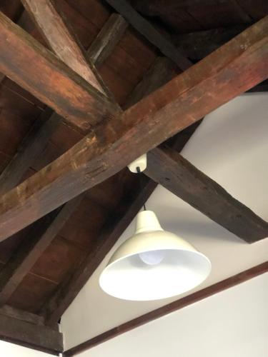 a ceiling fan with a white light on it at Apartamento Canónigo - terraza con vistas in Toledo