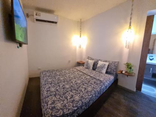 A bed or beds in a room at Casa Hostel San Andres