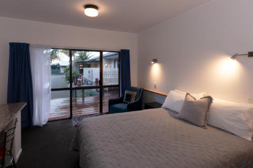 Postel nebo postele na pokoji v ubytování Aotearoa Lodge