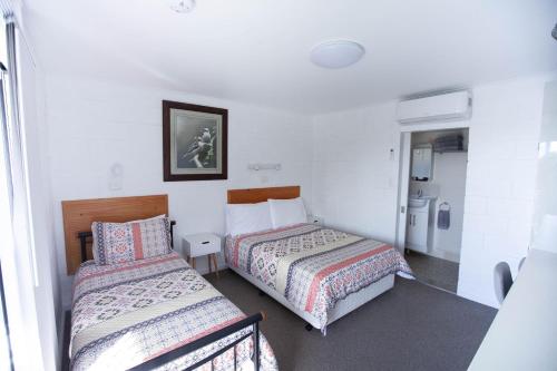 Cama ou camas em um quarto em Tuross Head Motel