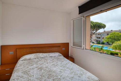 En eller flere senger på et rom på Apartament a Sant Antoni de Calonge