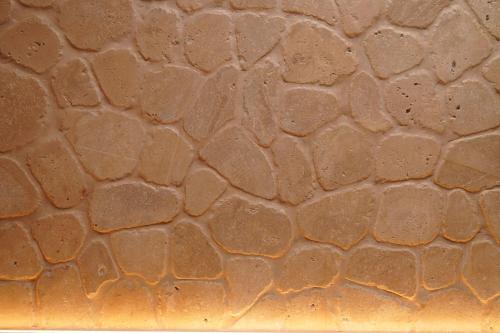 a close up of a brown stone floor with rain drops at Toon Armeni Guest House in Dilijan