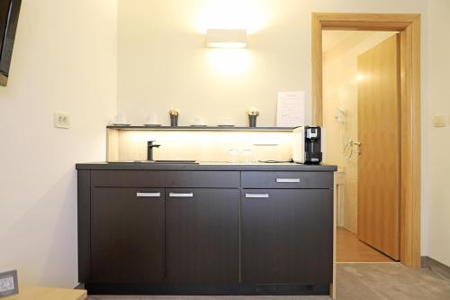 a bathroom with a sink and a counter top at Hotel Villa Margaret in Malinska
