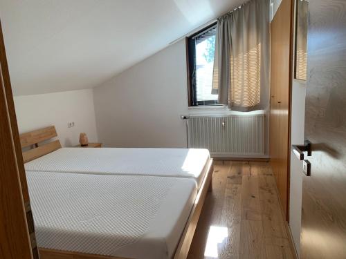 Ferienwohnung Allgäuglück tesisinde bir odada yatak veya yataklar