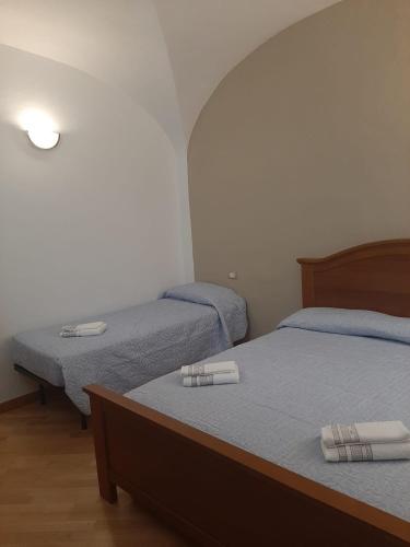 Postel nebo postele na pokoji v ubytování Alloggi Piazza Umberto Primo