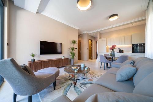 a living room with a couch and a table at C Group apartments in Kotor