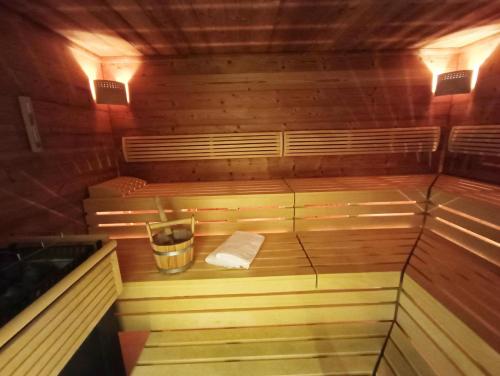 a sauna with a bucket and a towel in it at Golf Resort Klöch in Klöch
