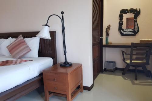Postel nebo postele na pokoji v ubytování Pai Sukhothai Resort SHA Extra Plus