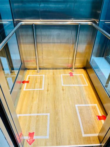 a bowling alley with red arrows on a wooden floor at Montana Hotel Songkhla in Songkhla
