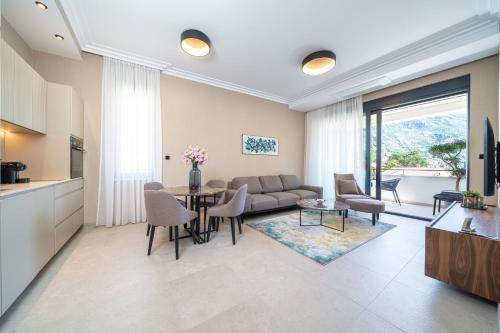 a living room with a couch and a table at C Group apartments in Kotor