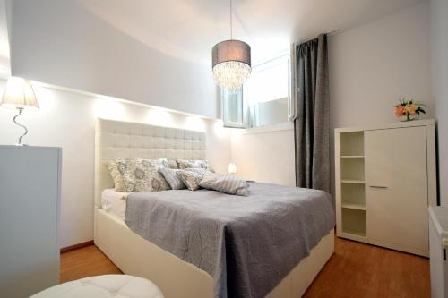 Postel nebo postele na pokoji v ubytování Apartments Antonija