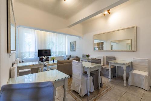 a kitchen with a dining room table and chairs at Regina Hotel in Skopelos Town