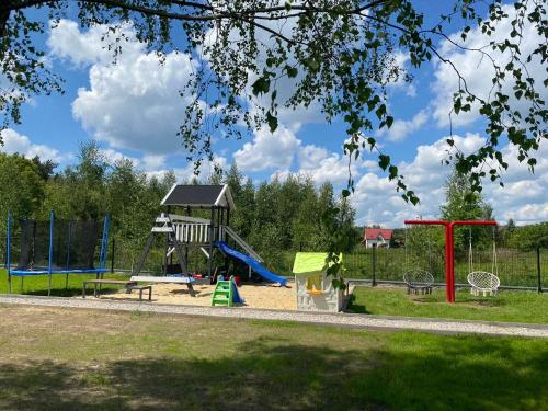 a park with a playground with a slide at Stara Kuźnia in Łuków