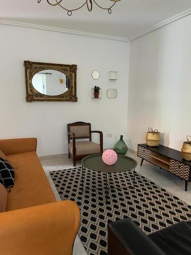 a living room with a couch and a table at Casa Las Piedras in Padrenda