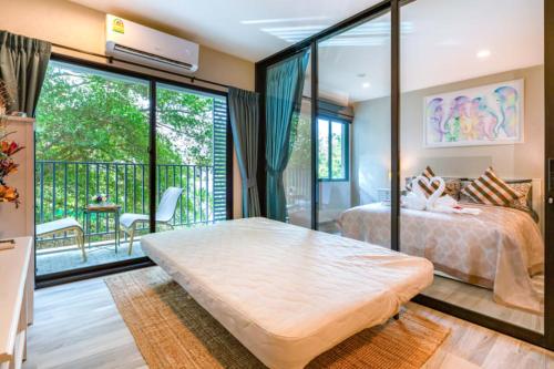 Een bed of bedden in een kamer bij Title НайЯнг NaiYang