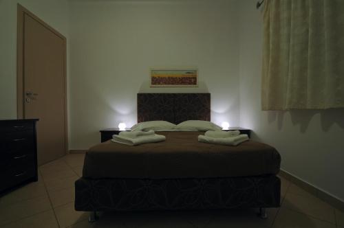Posteľ alebo postele v izbe v ubytovaní Anemoni