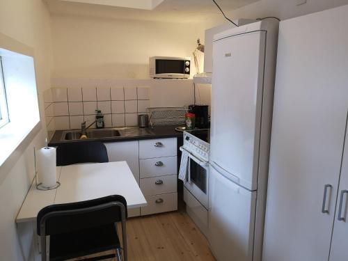 A kitchen or kitchenette at Stockholm B&B Cottage