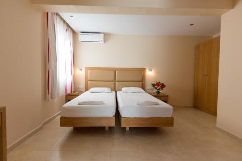 Postel nebo postele na pokoji v ubytování Amaryllis front beach hotel