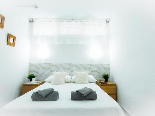 A bed or beds in a room at Lorentz Holiday Home