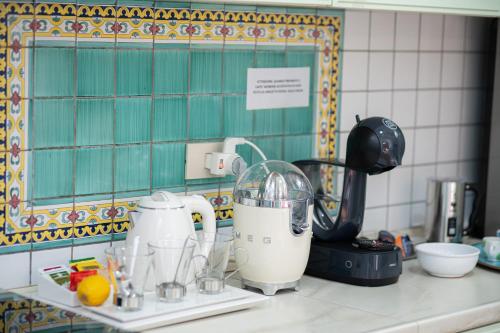 a kitchen counter with a blender and other appliances at Almaré B&B in Crotone
