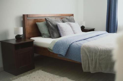 Кровать или кровати в номере Cosy Seaside Apartment