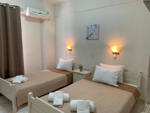 Postel nebo postele na pokoji v ubytování Velonis Apartments